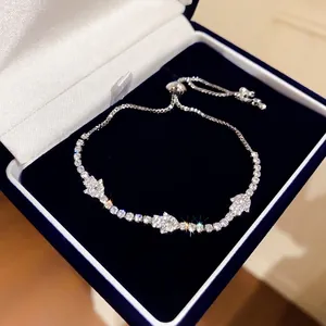 Sparkling silver-tone bracelet with eye charms in a premium dark blue velvet gift box.