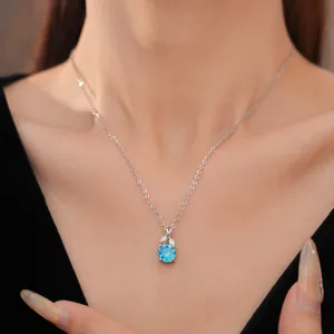 Elegant blue zircon flower pendant necklace on a vintage silver clavicle chain for women