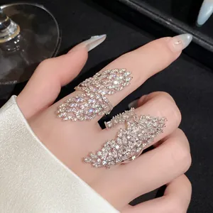 Macro view of a luxurious zircon encrusted hollow geometric open ring for women