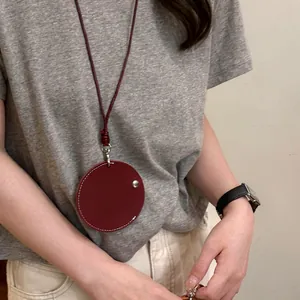 Minimalist burgundy leather circular pendant necklace with cord for glasses holder