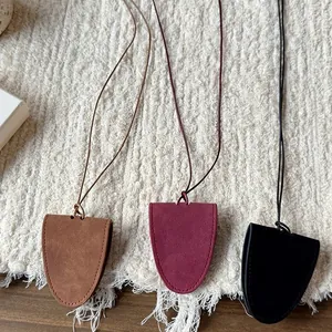 Minimalist magnetic leather clochette necklace for glasses in brown, burgundy and black.