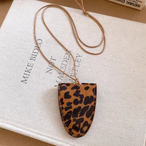Detailed macro view of a leopard print magnetic glasses holder necklace pendant