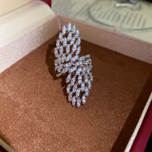Detailed view of a sparkling zircon hollow geometric open ring inside a jewelry gift box