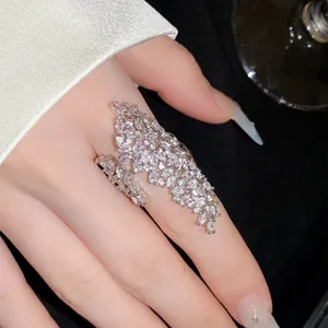 Close-up detail of a sparkling zirconia geometric open ring with marquise cut stones