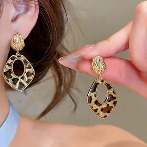 Leopard print acetate earrings with 14k gold plating for a vintage Maillard style