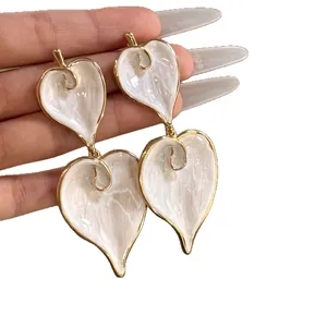 Elegant vintage white enamel heart-shaped drop earrings with gold-plated edges for women