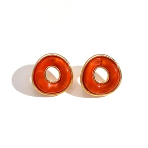 Vintage Ohrstecker aus orangefarbenem marmoriertem Acryl mit elegantem Goldrand