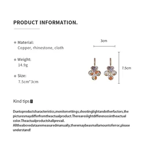 Detailed size and material information for heart-shaped floral cloth pendant earrings