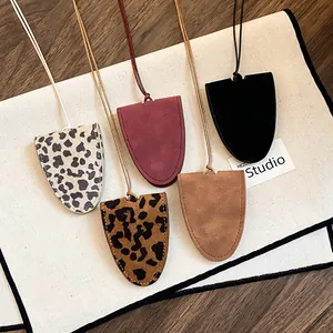Detailed view of stylish leopard print and solid color faux leather eyeglass holder necklaces.
