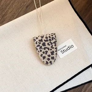Close-up detail of the leopard print glasses holder necklace with high-quality leather cord