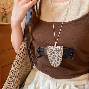 Leopard print glasses holder necklace lanyard accessory shown in a lifestyle setting