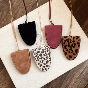 Detailed view of leopard print and leather glasses holder necklaces in various colors