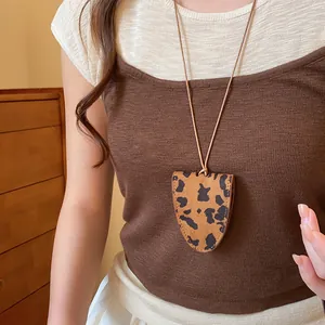 Leopard print glasses holder necklace with adjustable leather cord on model detail