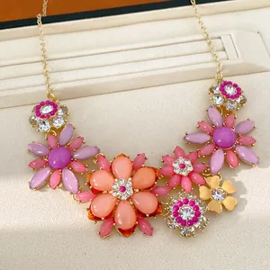 Close-up of a vintage rhinestone acrylic flower necklace in colorful sweet jewelry style