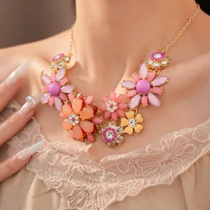 Close-up of colorful acrylic flower necklace with intricate rhinestone details
