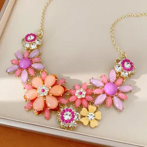 Close-up of detailed vintage acrylic flower necklace with shimmering inlaid rhinestones