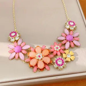 Macro view of a colorful vintage acrylic flower necklace with sparkling rhinestone accents