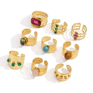 Set of assorted gold stainless steel adjustable rings featuring various natural stones