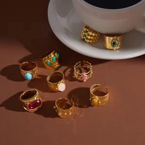 Collection of vintage-style gold stainless steel rings with various natural gemstones