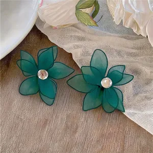 Elegant dark green fabric flower stud earrings with central zircon and silver pins.