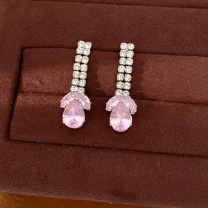Detailed view of elegant pink water drop zircon earrings in a premium velvet gift box