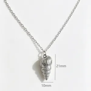 Close-up detail of the stainless steel conch shell necklace pendant with dimensions