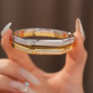 Close-up of gold and silver plated bangles with shimmering micro-pave zircons
