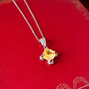 French palace style silver necklace with square yellow zircon pendant on red box