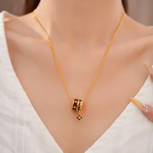 Detailed shot of gold plated necklace with colorful enamel beads and zircon flower