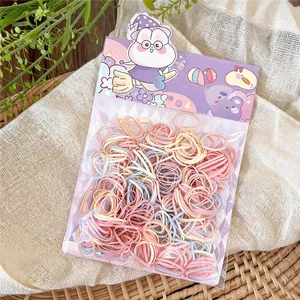 Detail view of colorful dopamine disposable rubber bands in cute bunny gift packaging