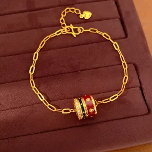 24K gold plated bracelet with red and black enamel charm and cubic zirconia accents