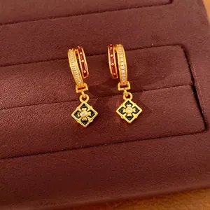 Exquisite 24K gold plated earrings with zircon inlays and black enamel flower detail