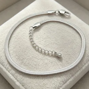 Detailed close-up of 3mm stainless steel silver snake chain bracelet on jewelry pad