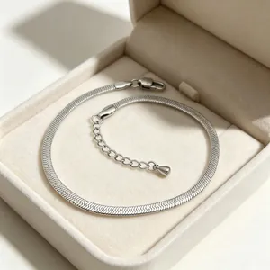 Detail showing the fine texture of a 3mm stainless steel silver blade chain bracelet.
