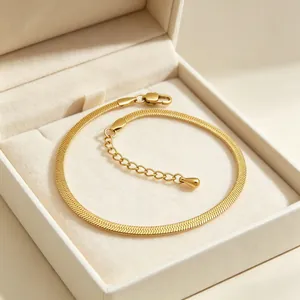 Elegant 3mm stainless steel 18K gold plated snake chain bracelet inside a cream jewelry box