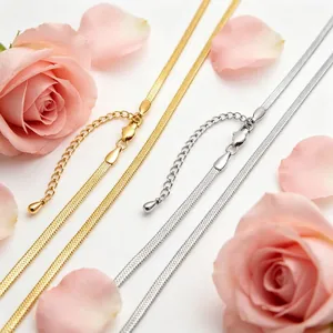 Detail view of 3mm gold and silver stainless steel blade chains with rose petals