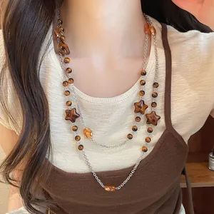 Vintage Maillard style layered beaded necklace with star charms and amber accents