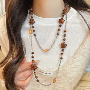 Detailed view of a retro Maillard style beaded necklace with star and crystal accents.
