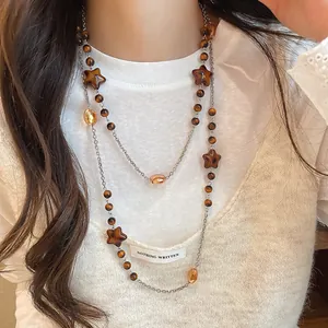 Retro Maillard style double-layer necklace with star shapes and brown crystal beads