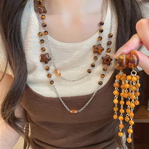 Detailed view of a Maillard vintage beaded jewelry set featuring a necklace and tassel earrings