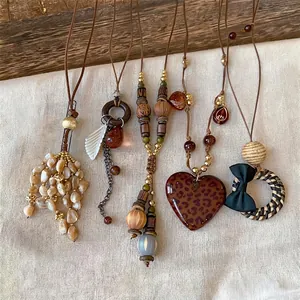Assorted vintage ethnic style long sweater chains with decorative shell and wood pendants