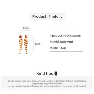 Detailed size and material info for vintage resin and wood bead tassel earrings.