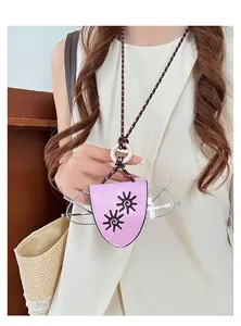 Detailed view of a pink leather sunflower glasses holder pendant on a colorful rope necklace
