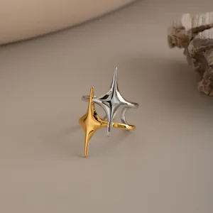 Close-up of vintage double star ring with gold and silver finishes in stainless steel