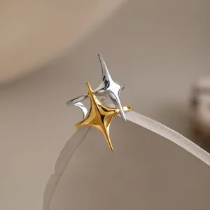 Detailed close-up view of a French retro double star open ring with 18K gold finish