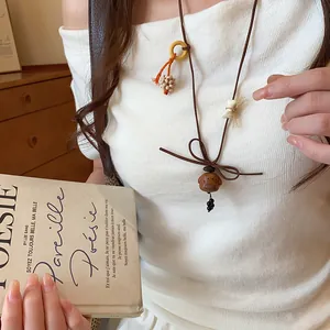 Handmade wooden puppy pendant necklace with cute velvet cord design and butterfly knot detail