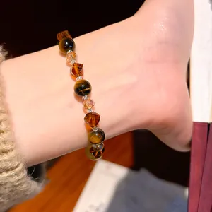 Detail view of Maillard style vintage crystal and tiger eye stone beaded bracelet on wrist