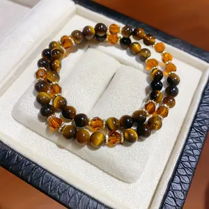 Exquisite close-up of retro tiger eye and crystal beaded bracelet in a jewelry gift box