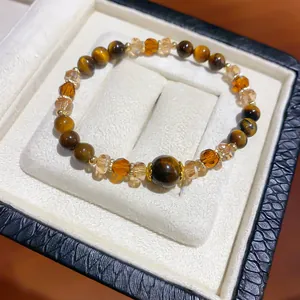 Close-up shot of Maillard retro tiger eye stone bracelet in an elegant jewelry gift box