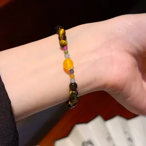 Exquisite close-up of vintage Maillard style tiger eye crystal beaded bracelet on a wrist